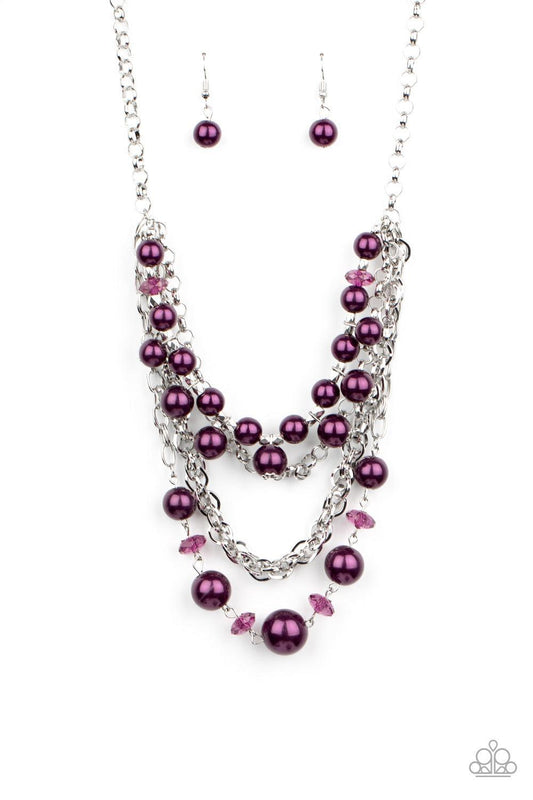 Paparazzi Accessories Rockin Rockette - Purple Varying in size, purple pearls, purple crystal-like beads, and faceted silver beads join with mismatched silver chains below the collar, creating a radically refined fringe. Features an adjustable clasp closu