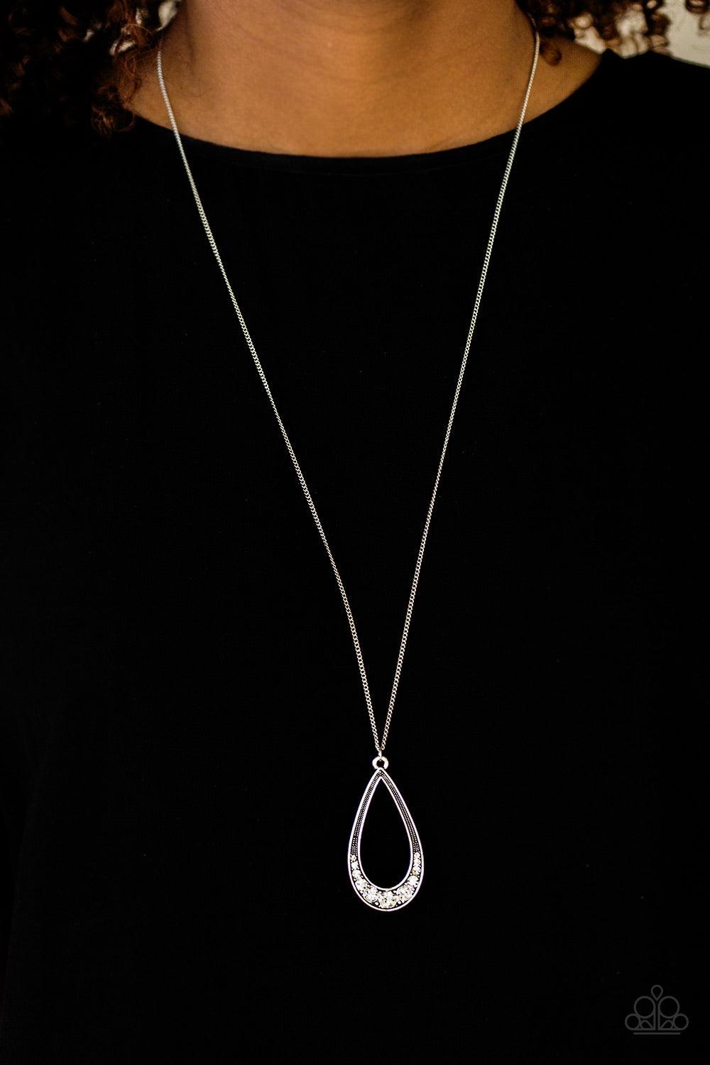 Paparazzi Accessories Teardrop Tease - White Swinging from the bottom of an elongated silver chain, the bottom of a glistening silver teardrop is encrusted in glassy white rhinestones, creating a refined pendant. Features an adjustable clasp closure. Sold