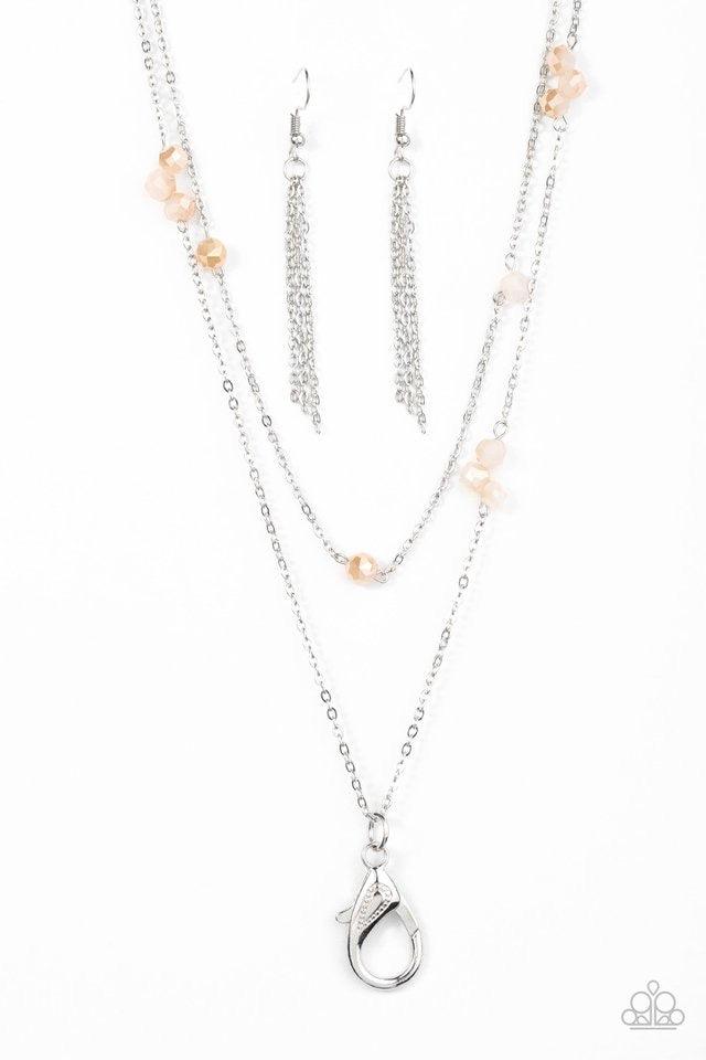 Paparazzi Accessories Swag and Sparkle - Brown *Lanyard Opaque crystal-like beads trickle along two strands of shimmery silver chain, creating glittery accents across the chest. A lobster clasp hangs from the bottom of the design to allow a name badge or
