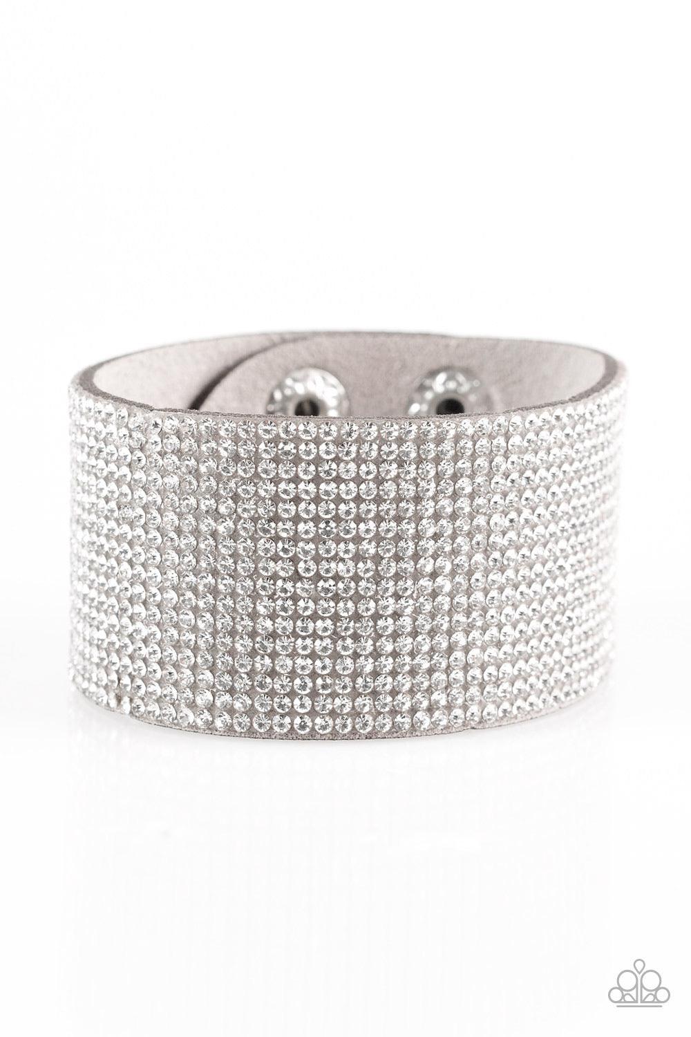 Paparazzi Accessories Roll With The Punches - Silver Row after row of glassy white rhinestones are encrusted along a thick gray suede band, creating knockout shimmer across the wrist. Features an adjustable snap closure. Sold as one individual bracelet. J
