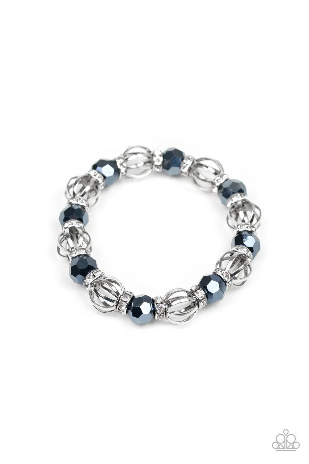 Paparazzi Accessories Metro Squad - Blue A collection of airy silver beads, faceted blue metallic beads, and white rhinestone encrusted rings are threaded along a stretchy band around the wrist for a glamorous look. Jewelry