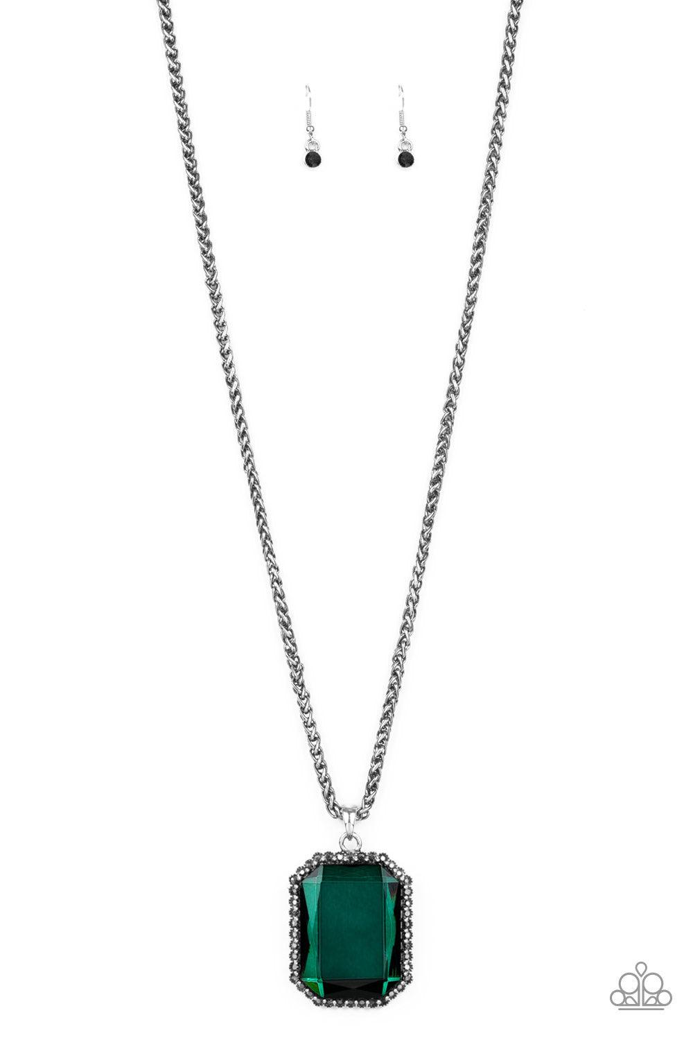 Paparazzi Accessories Let Your HEIR Down - Green Bordered in dainty hematite rhinestones, an oversized faceted green emerald style gem swings from the bottom of an antiqued silver wheat chain for a blinding look. Features an adjustable clasp closure. Jewe