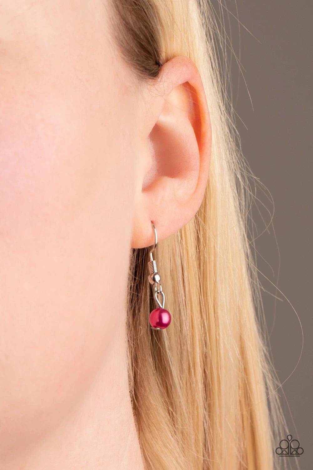 Paparazzi Accessories A Touch of CLASSY - Pink Infused with silver chain, vivacious pink pearls are threaded along an invisible wire below the collar. Matching pink pearls and glittery white rhinestones swing from the pearly strand, creating a flirtatious