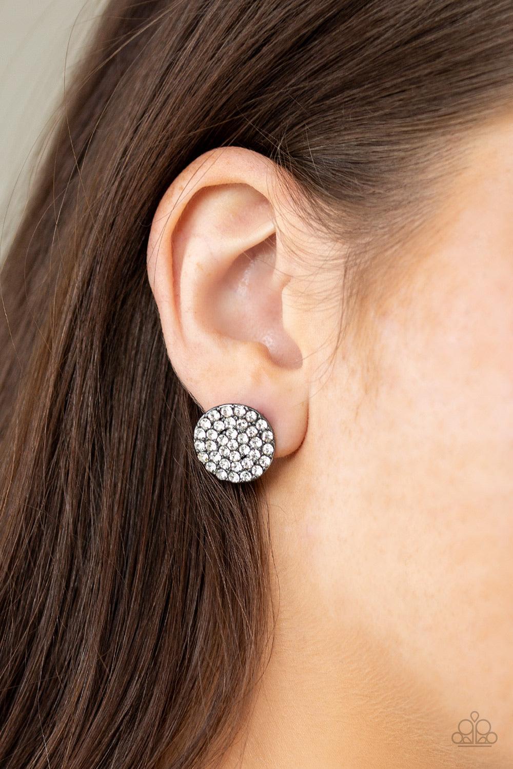 Paparazzi Accessories Bling Tastic! - White Featuring a regal square-cut, a glittery white gem is pressed into a frame radiating with glassy white rhinestones for a timeless flair. Earring attaches to a standard post fitting. Sold as one pair of post earr
