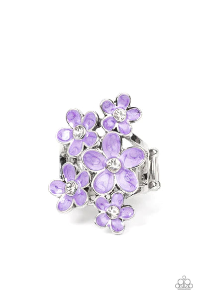 Paparazzi Accessories Boastful Blossoms - Purple Dotted with dainty white rhinestone centers, a bouquet of shiny purple flowers blooms across the finger for a sensational seasonal look. Features a stretchy band for a flexible fit. Sold as one individual r