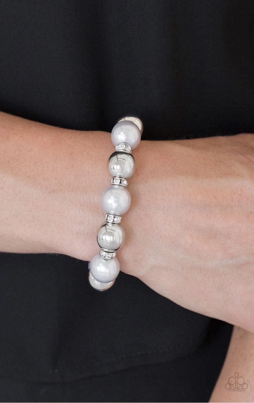 Paparazzi Accessories So Not Sorry - White A collection of white rhinestone encrusted rings, silver pearls, and classic silver beads are threaded along a stretchy band around the wrist for a glamorous look. Sold as one individual bracelet. Jewelry
