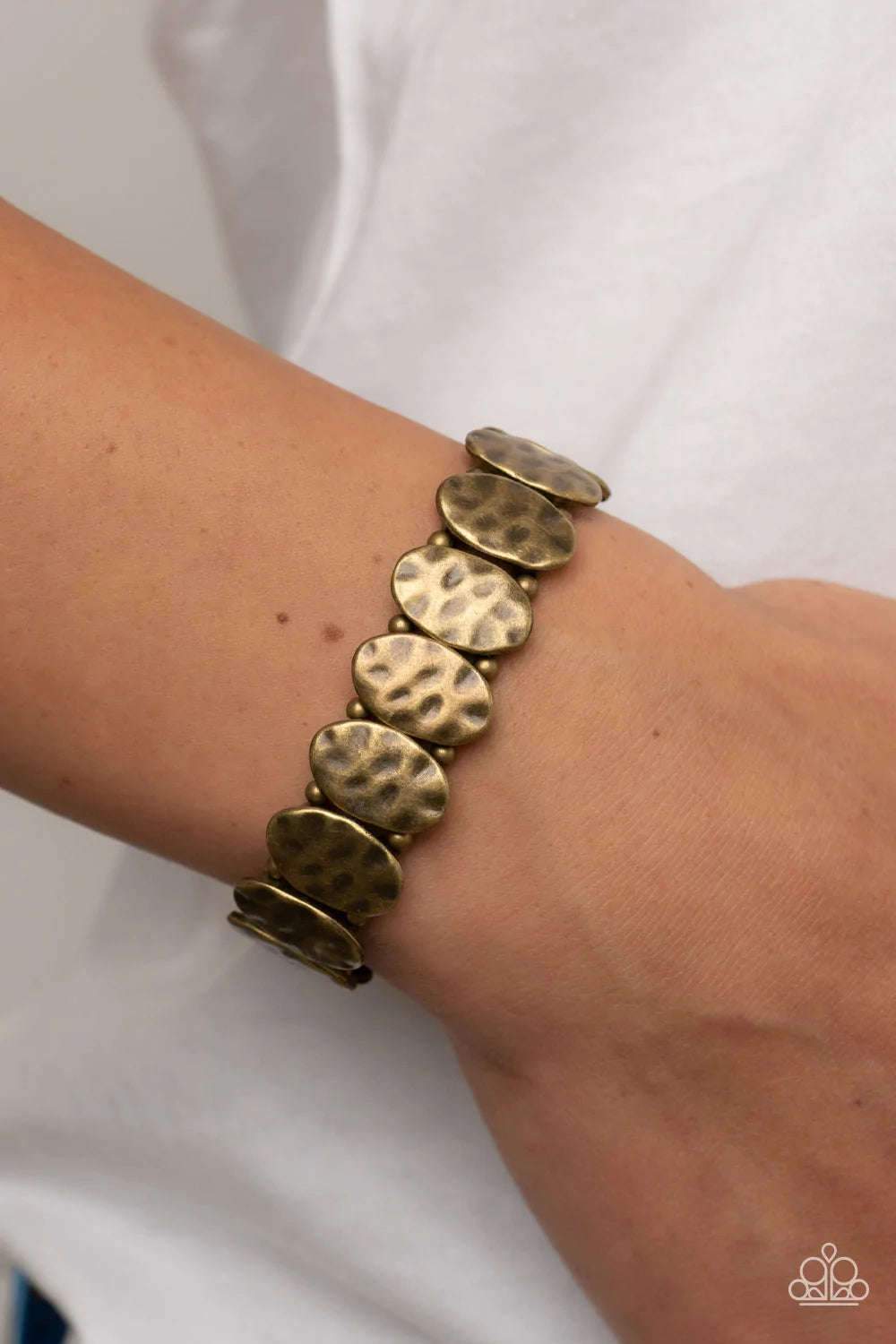 Paparazzi Accessories Trinket Trek - Brass Infused with pairs of dainty brass beads, a hammered collection of antiqued brass ovals are threaded along stretchy bands around the wrist for a rustic flair. Sold as one individual bracelet. Jewelry