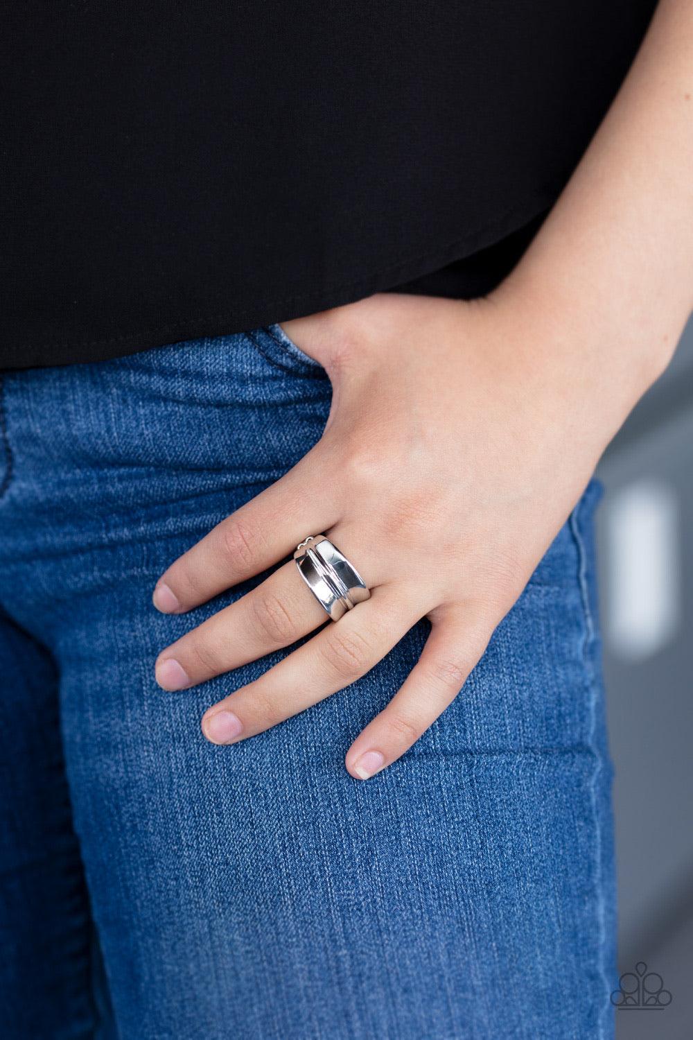 Paparazzi Accessories Band Together - Silver Brushed in a high-sheen finish, a rippling silver band arcs across the finger for a classic look. Features a dainty stretchy band for a flexible fit. Sold as one individual ring. Jewelry