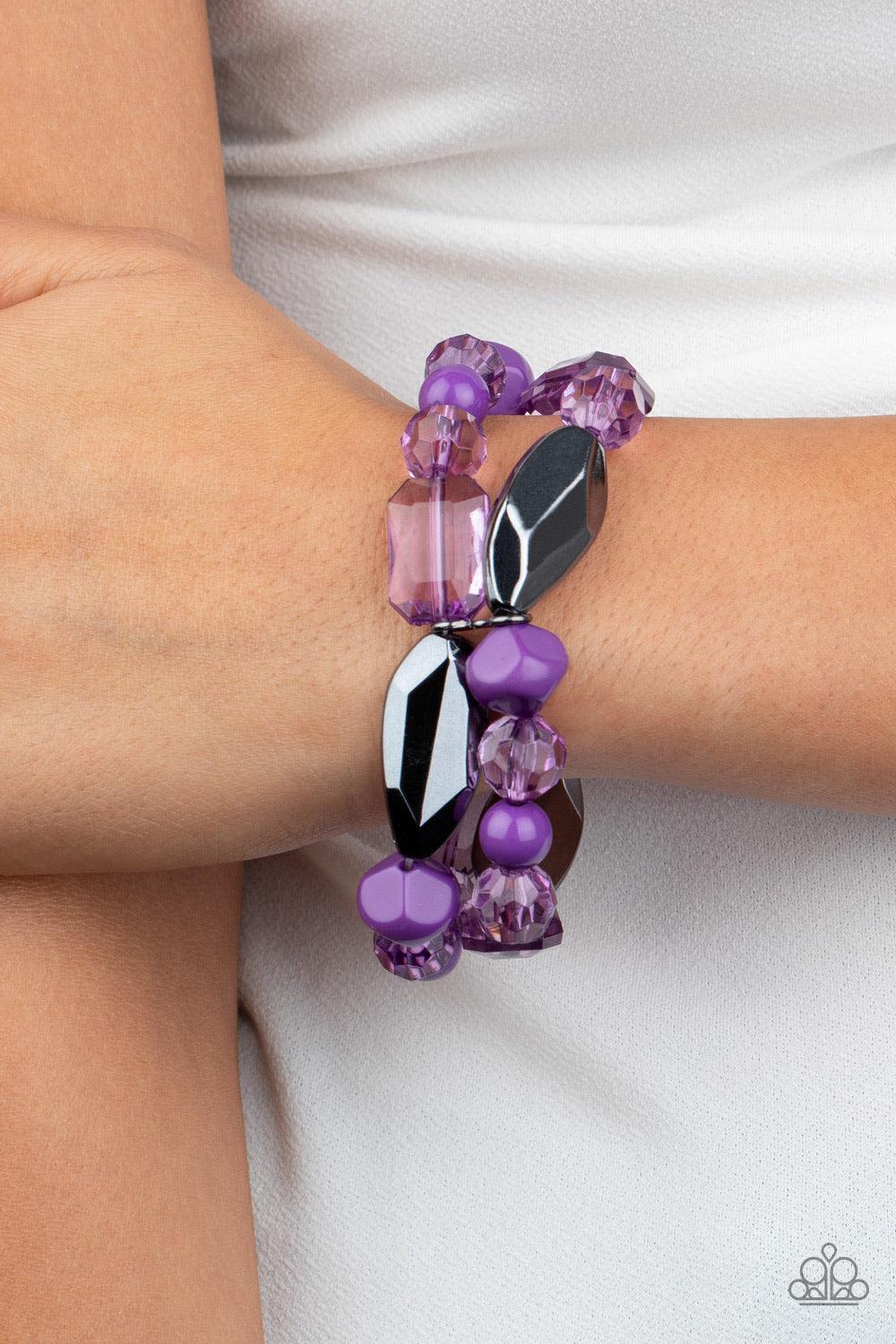 Paparazzi Accessories Rockin Rock Candy - Purple Mismatched gunmetal, polished purple, and crystal-like beads are threaded along interlocking stretchy bands for a whimsical look. Sold as one individual bracelet. Jewelry