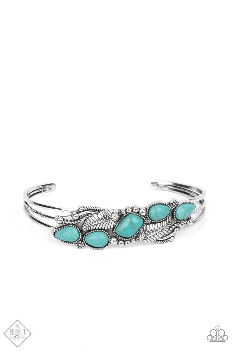Paparazzi Accessories Cottage Living - Blue A collection of asymmetrical turquoise stones adorns the front of a studded silver frame embossed in floral and feathery accents atop a layered silver cuff. Sold as one individual bracelet. Jewelry