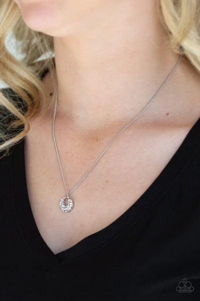 Paparazzi Accessories One Small Step for GLAM - White Encrusted in glittery white rhinestones, a dainty silver pendant swings below the collar for a glamorous look. Features an adjustable clasp closure.Sold as one individual necklace. Includes one pair of