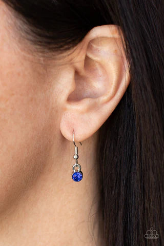 Paparazzi Accessories United We Sparkle - Blue A blue rhinestone encrusted silver star is flanked by two dainty white rhinestone encrusted silver stars, creating a sparkly patriotic pendant below the collar. Features an adjustable clasp closure. Sold as o