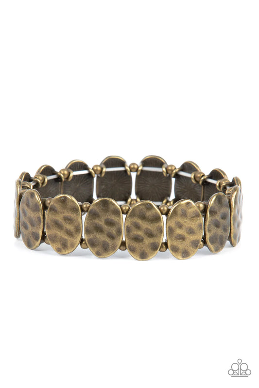 Paparazzi Accessories Trinket Trek - Brass Infused with pairs of dainty brass beads, a hammered collection of antiqued brass ovals are threaded along stretchy bands around the wrist for a rustic flair. Sold as one individual bracelet. Jewelry