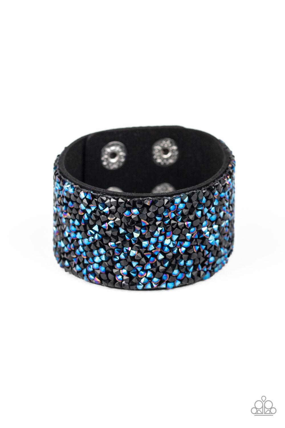 Paparazzi Accessories Rhinestone Runway - Multi Dainty black and metallic blue rhinestone prisms are sprinkled across the center of a thick black suede band, creating a sassy dazzle around the wrist. Features an adjustable snap closure. Jewelry