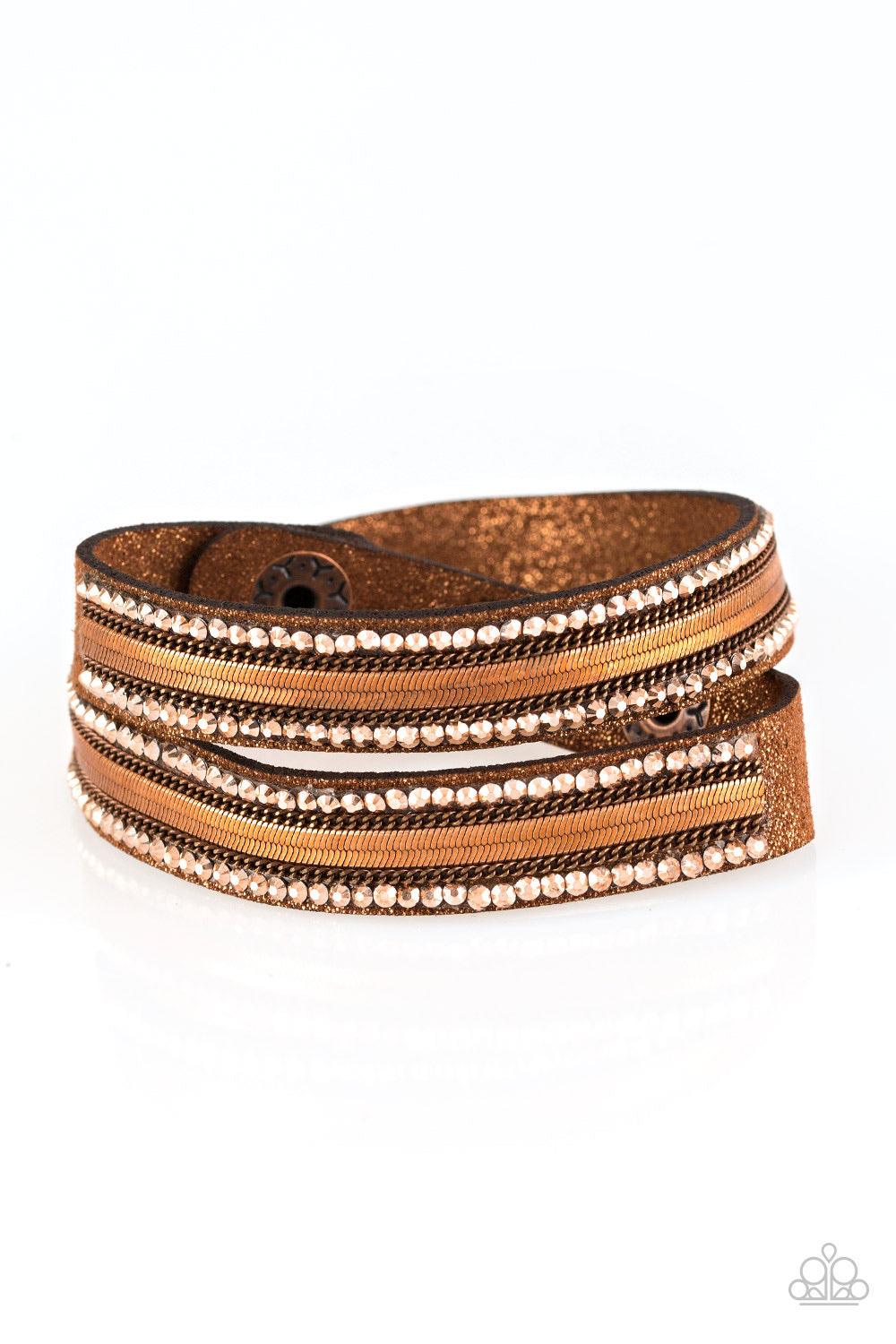 Paparazzi Accessories Rocker Rivalry - Copper Rows of classic copper chain, flat copper chain, and dainty metallic rhinestones are encrusted along a brown suede band dusted in golden sparkles for a sassy look. The elongated band allows for a trendy double