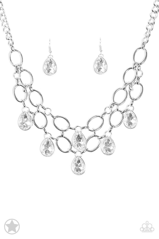 Paparazzi Accessories Show-Stopping Shimmer - White Joined by dainty silver links, two rows of dramatic silver chain layer below the collar in a fierce fashion. Glittery white teardrops drip from the glistening layers, adding a timeless shimmer to the sho