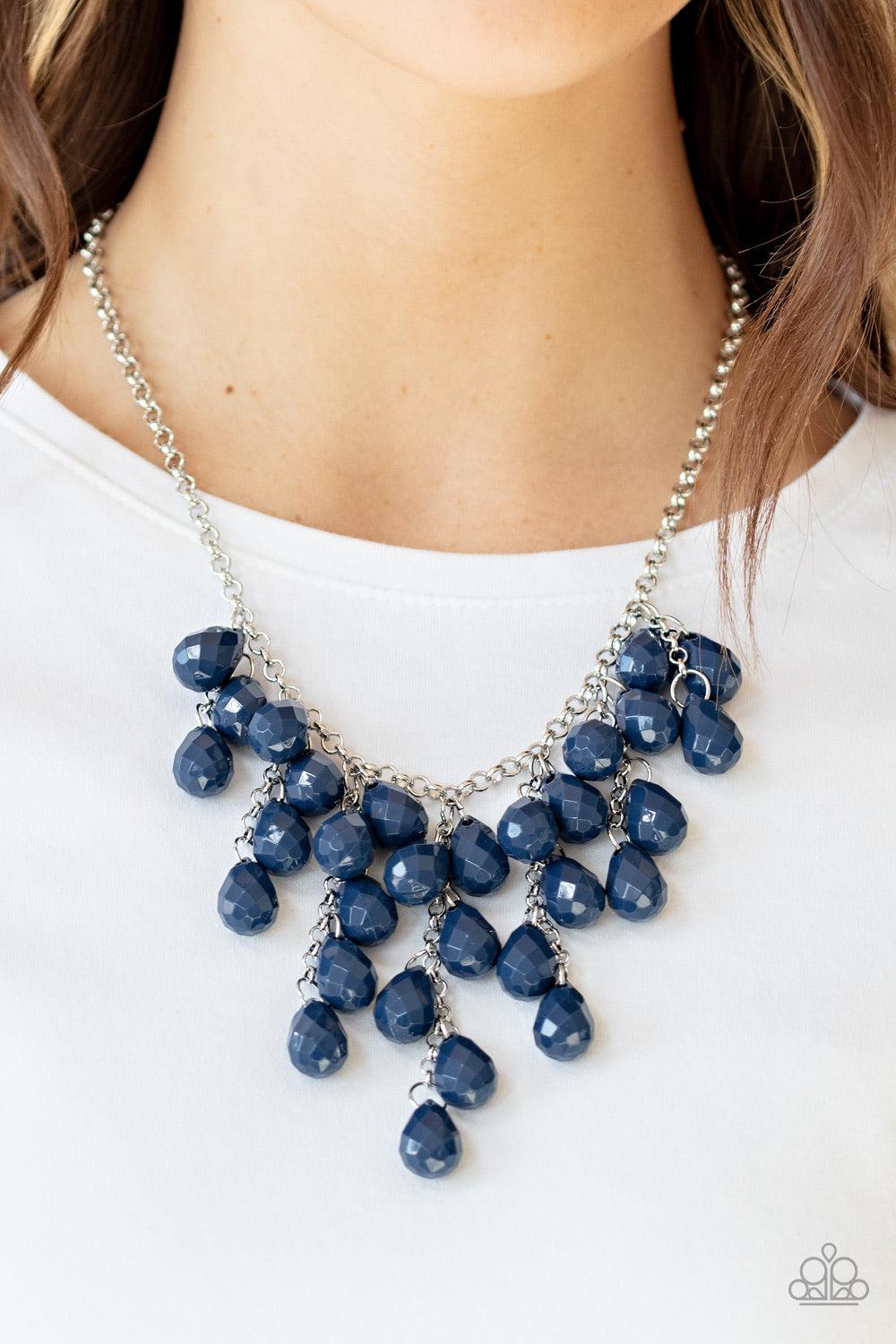 Paparazzi Accessories Serenely Scattered - Blue Strands of faceted blue teardrops cascade from the bottom of a shimmery silver chain, creating a vivacious scattered fringe below the collar. Features an adjustable clasp closure. Jewelry