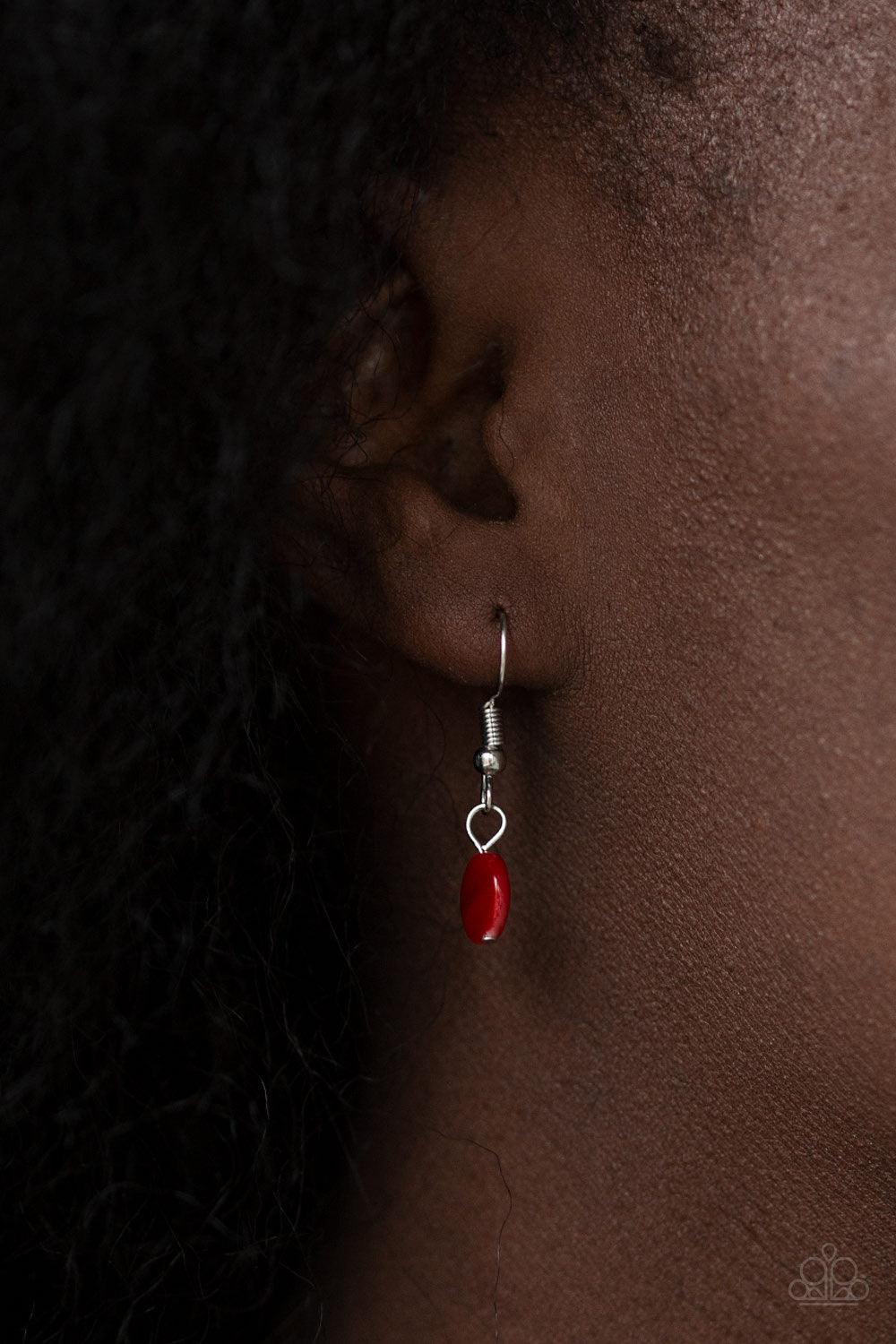 Paparazzi Accessories Beach Flavor - Red Mismatched silver chains layer below the collar. Shell-like red beads and shiny silver beads trickle from the lowermost chain, creating an iridescent fringe. Features an adjustable clasp closure. Jewelry
