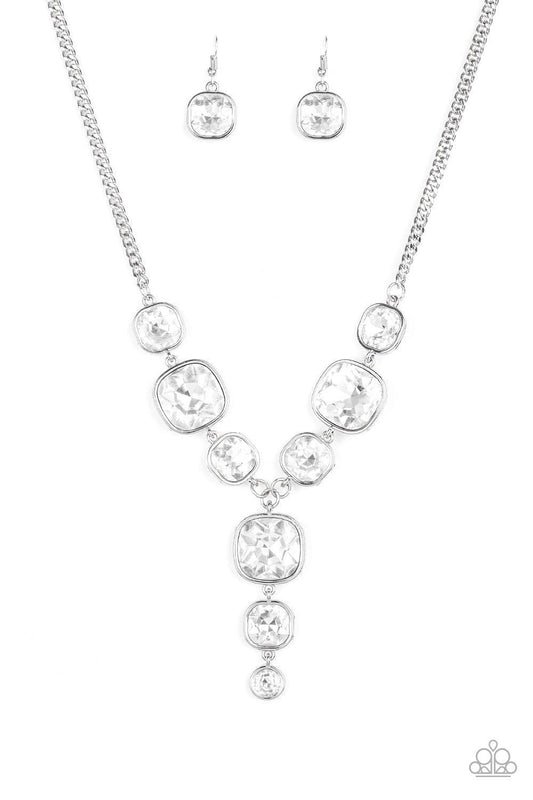 Paparazzi Accessories Legendary Luster - White Featuring sleek silver frames, a dramatic collection of white gems cascade from the bottom thick silver chain. Additional gems trickle from the center, creating a glamorous extended pendant below the collar.
