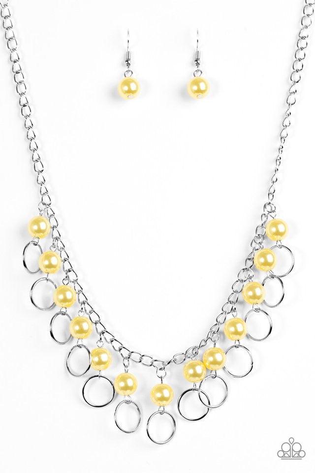 Paparazzi Accessories Run The Show - Yellow Classic yellow pearls trickle from the bottom of a glistening silver chain. Shimmery silver hoops cascade from the pearls, creating a flirty fringe below the collar. Features an adjustable clasp closure. Jewelry