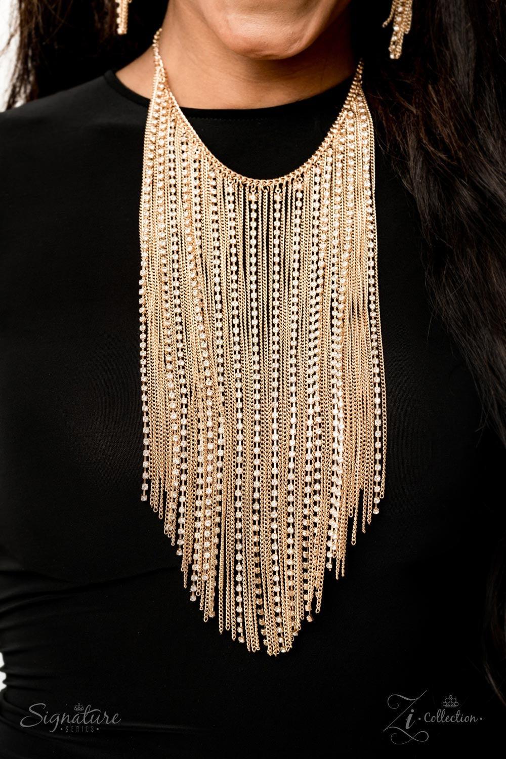 Paparazzi Accessories The Ramee 💗ZiCollection $25💗 A curtain of shimmering gold chains and dazzling white rhinestones cascades down the chest, creating a fearless fringe. The scintillating chains subtly increase in length towards the center, tapering in