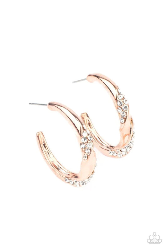Paparazzi Accessories Subliminal Shimmer - Copper Ribbons of white rhinestones wrap around a dainty shiny copper hoop that has been chiseled and twisted, adding extra dimension. Earring attaches to a standard post fitting. Hoop measures approximately 1" i