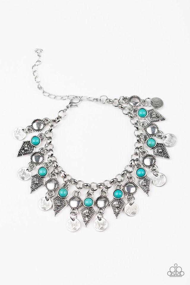 Paparazzi Accessories Triassic Trade Route ~Blue Featuring studded detail and refreshing turquoise stone accents, mismatched silver frames swing from the bottom of a bold silver chain, creating a flirty fringe around the wrist. Features an adjustable clas