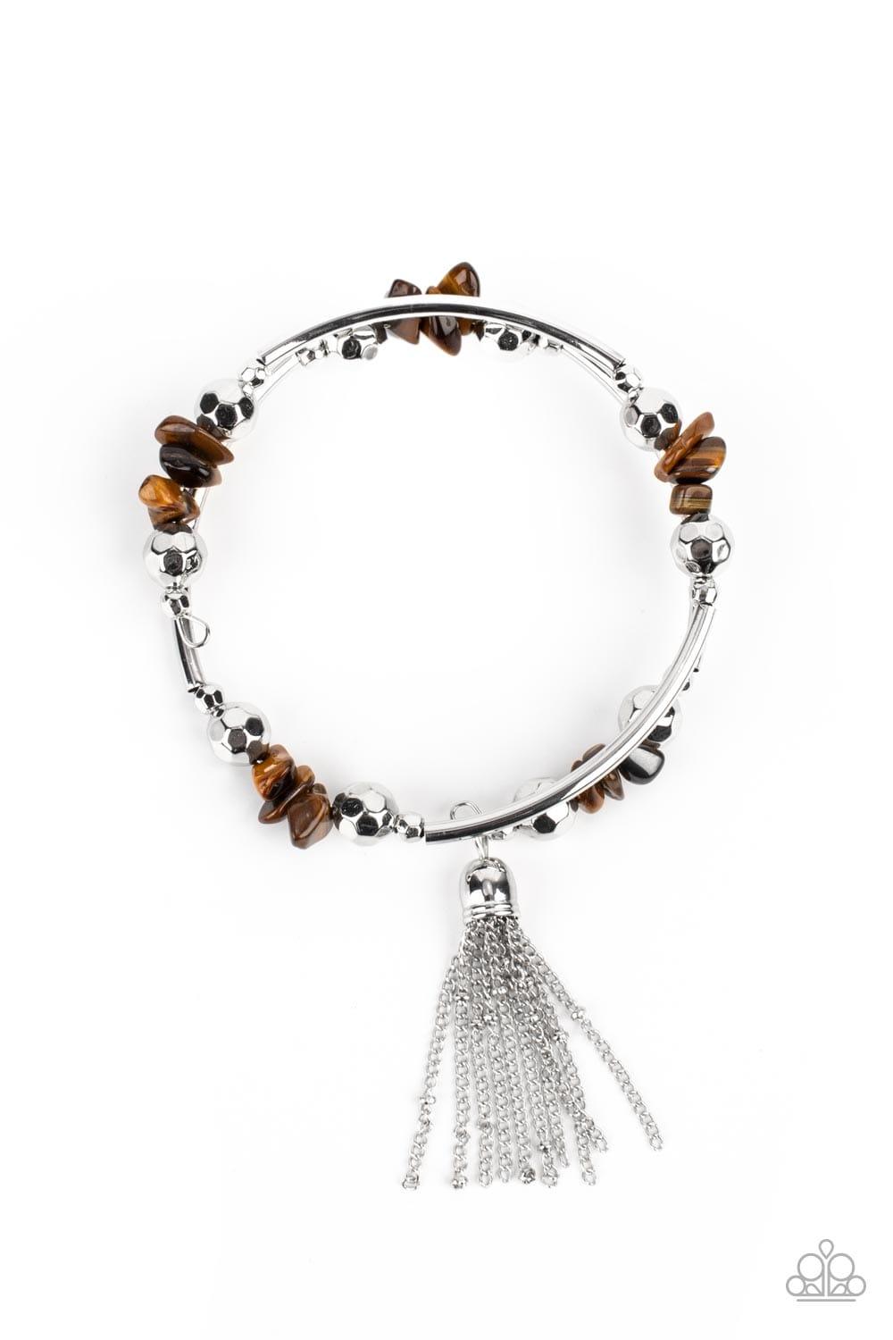 Paparazzi Accessories Mineral Mosaic - Brown An earthy collection of faceted silver beads, raw cut tiger's eye rock beads, and cylindrical silver accents are threaded along a coiled wire around the wrist for a grounding pop of color. A shimmery silver cha
