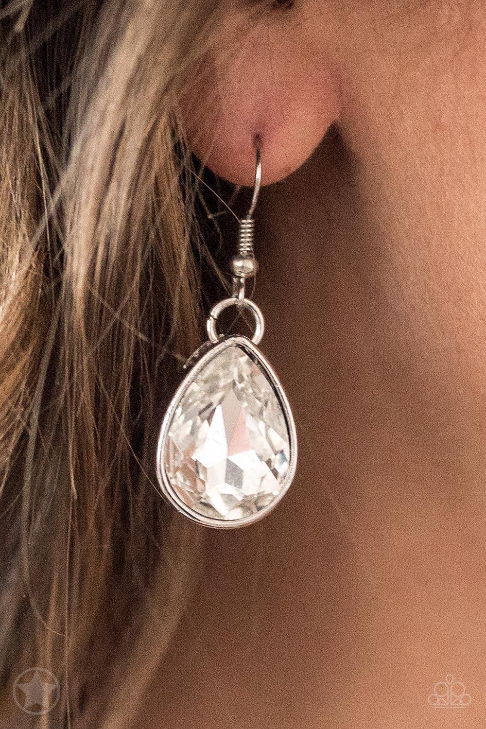 Paparazzi Accessories Show-Stopping Shimmer - White Joined by dainty silver links, two rows of dramatic silver chain layer below the collar in a fierce fashion. Glittery white teardrops drip from the glistening layers, adding a timeless shimmer to the sho