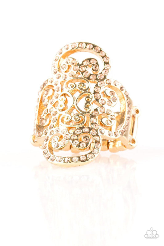 Paparazzi Accessories Regal Regalia - Gold Dainty peach rhinestones are encrusted along a glistening gold frame radiating with regal filigree for a refined look. Features a stretchy band for a flexible fit. Jewelry