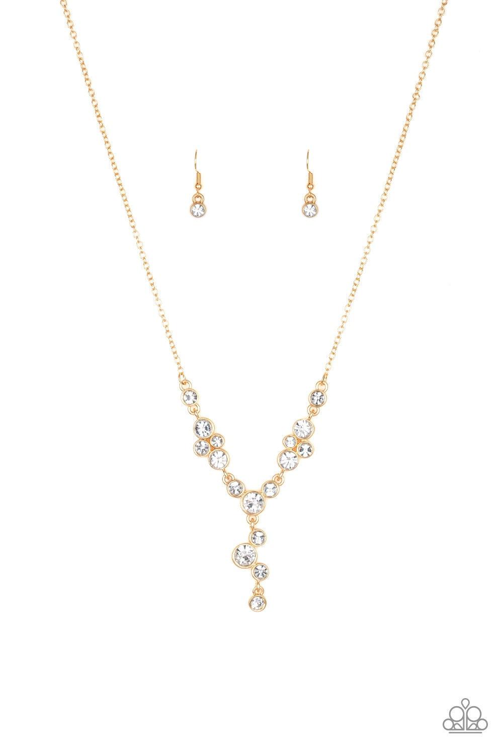 Paparazzi Accessories Five-Star Starlet - Gold Encased in sleek gold frames, a collection of glittery white rhinestones coalesce into dazzling frames below the collar. Matching rhinestones trickle from the center, creating a glamorous extended pendant. Fe