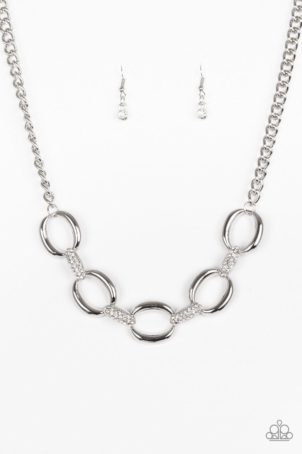 Paparazzi Accessories Boss Boulevard - White Bold silver links join with white rhinestone encrusted frames below the collar for a fierce look. Features an adjustable clasp closure. Jewelry