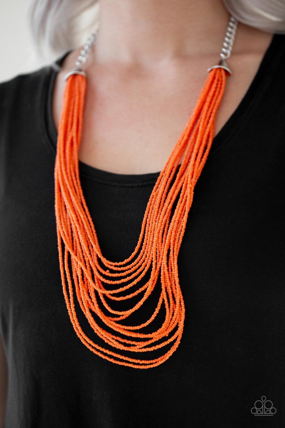 Paparazzi Accessories Peacefully Pacific - Orange Infused with two bold silver fittings, row after row of orange seed beads layer across the chest for a seasonal fashion. Features an adjustable clasp closure. Jewelry