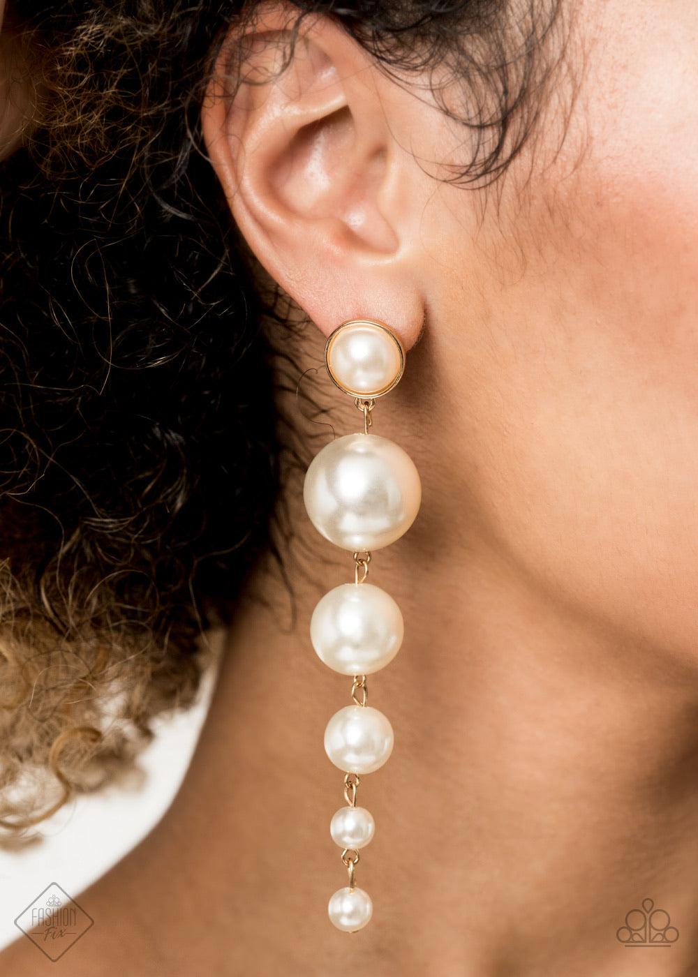 Paparazzi Accessories Living A WEALTHY Lifestyle - Gold Attached to a matching pearl beaded gold fitting, a bubbly collection of pearls decrease in size as they trickle from the ear, linking into a dramatically elegant lure. Earring attaches to a standard