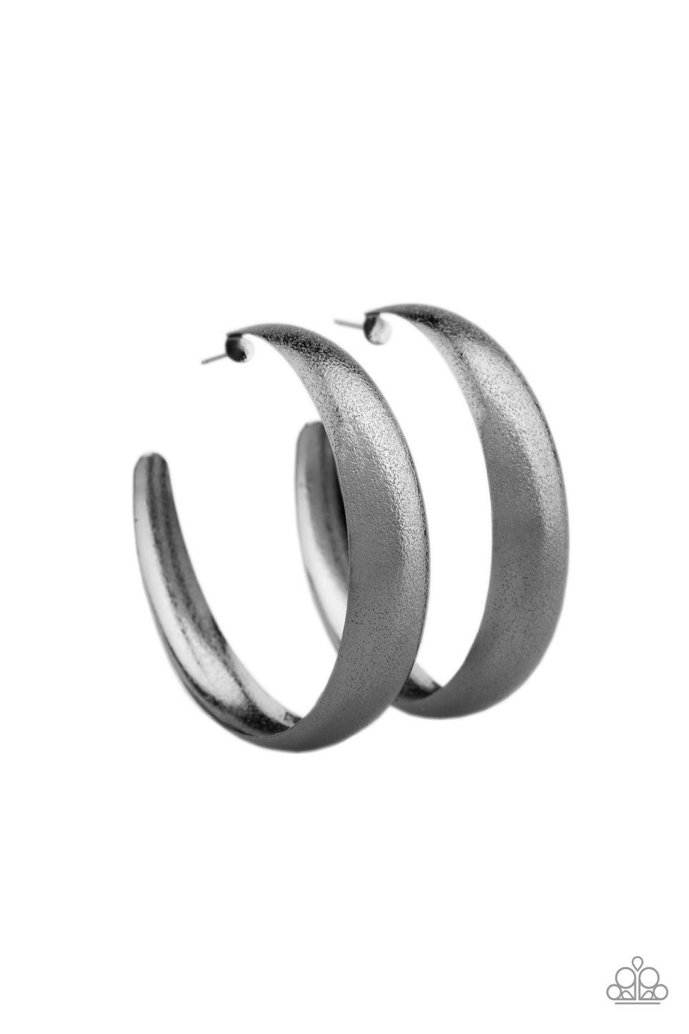 Paparazzi Accessories HOOPS! I Did It Again - Gunmetal Hammered in blinding shimmer, a thick gunmetal hoop curls around the ear for a grunge-glamorous look. Earring attaches to a standard post fitting. Hoop measures approximately 2 1/4" in diameter. Jewel