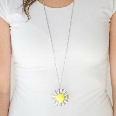 Paparazzi Accessories My Primary Color - Yellow Swinging from the bottom of an elongated silver chain, a dramatic yellow bead is pressed into the center of a scalloped silver frame, creating a bold pendant. Features an adjustable clasp closure. Jewelry