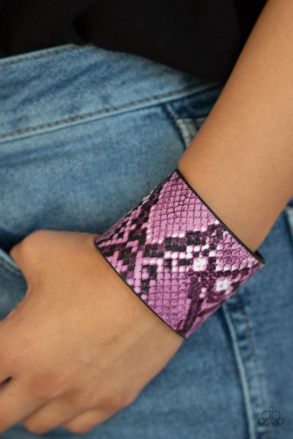 Paparazzi Accessories The Rest Is HISS-tory - Purple Featuring vibrant purple and white python print, a thick black leather band wraps around the wrist for a wild fashion. Features an adjustable snap closure. Jewelry