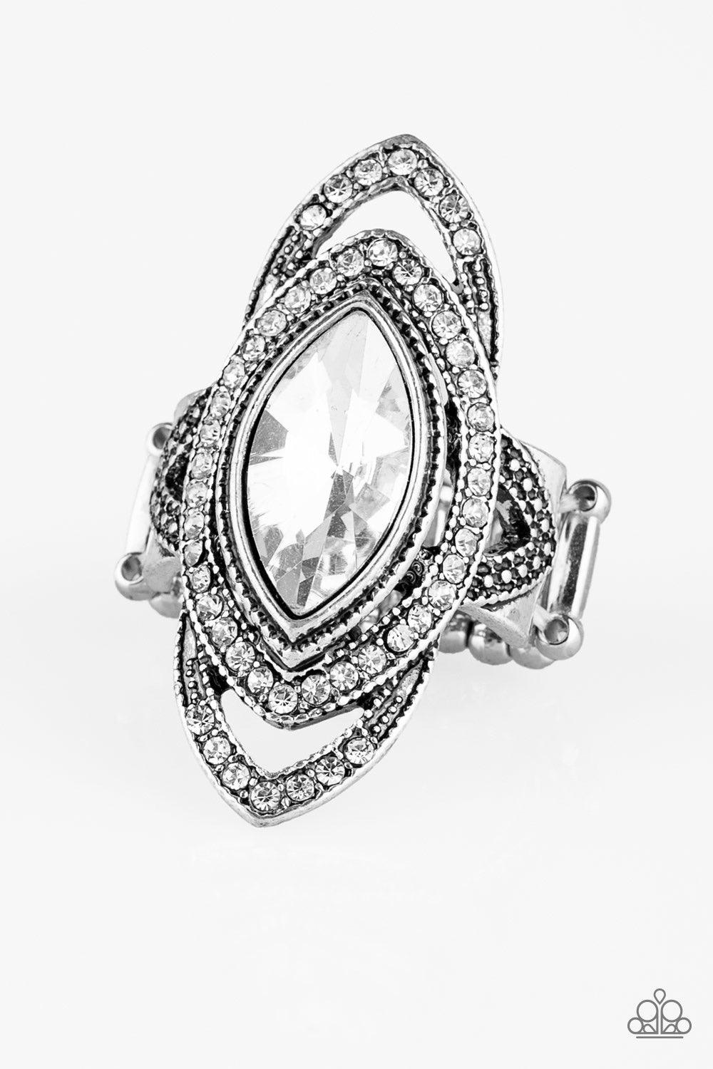 Paparazzi Accessories Hot Off The EMPRESS - White Encrusted in glassy white rhinestones, a glittery silver band encircles an oversized marquise style rhinestone for a dramatic look. Features a stretchy band for a flexible fit. Jewelry