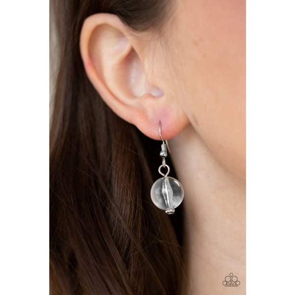 Paparazzi Accessories Gorgeously Globetrotter - White Varying in shape and shimmer, smooth and faceted glassy beads trickle from doubled silver chain links, creating a glamorous fringe below the collar. Features an adjustable clasp closure. Sold as one in