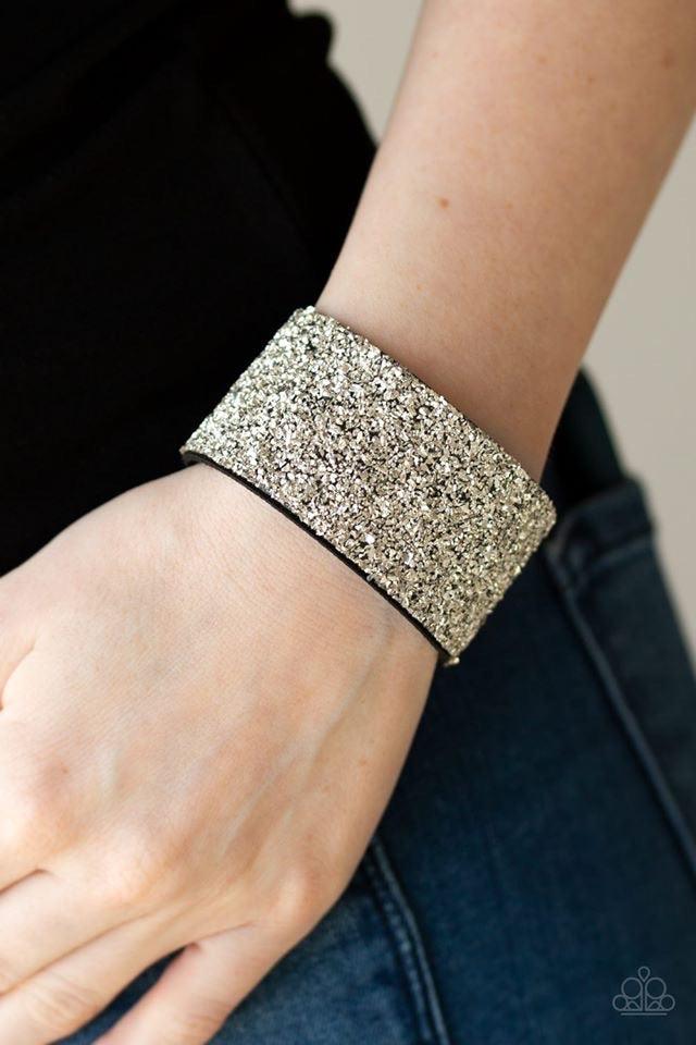 Paparazzi Accessories The Halftime Show - Silver Crushed bits of silver accents are sprinkled along the center of a thick black suede band, creating a blinding shimmer around the wrist. Features an adjustable snap closure. Jewelry