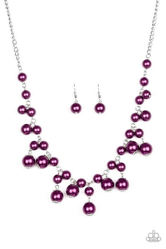Paparazzi Accessories Soon To Be Mrs. - Purple Varying in size, bubbly purple pearls swing from the bottom of a classic strand of pearls, creating a refined fringe below the collar. Features an adjustable clasp closure. Jewelry