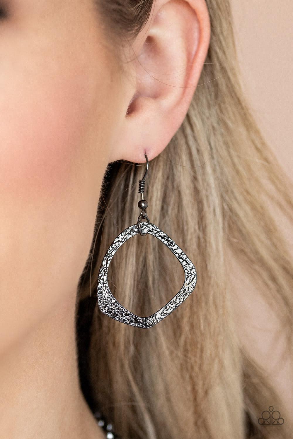 Paparazzi Accessories Salvage Yard ~Black Salvage Yard - Black P2ST-BKXX-112XX Hammered in shimmery detail, oversized asymmetrical gunmetal rings and gritty gunmetal links boldly link below the collar in two dramatic rows for a sassy industrial look. Feat