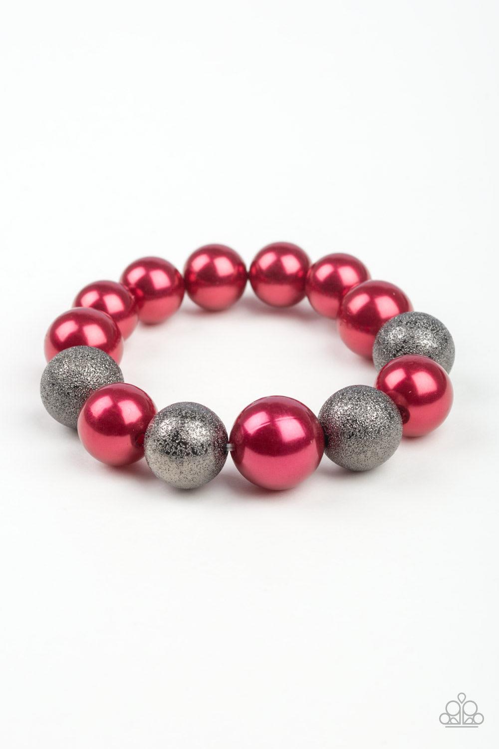 Paparazzi Accessories Humble Hustle - Red Dusted in glitter, sparkling gunmetal and pearly red beads are threaded along a stretchy band around the wrist for a glamorous look. Jewelry