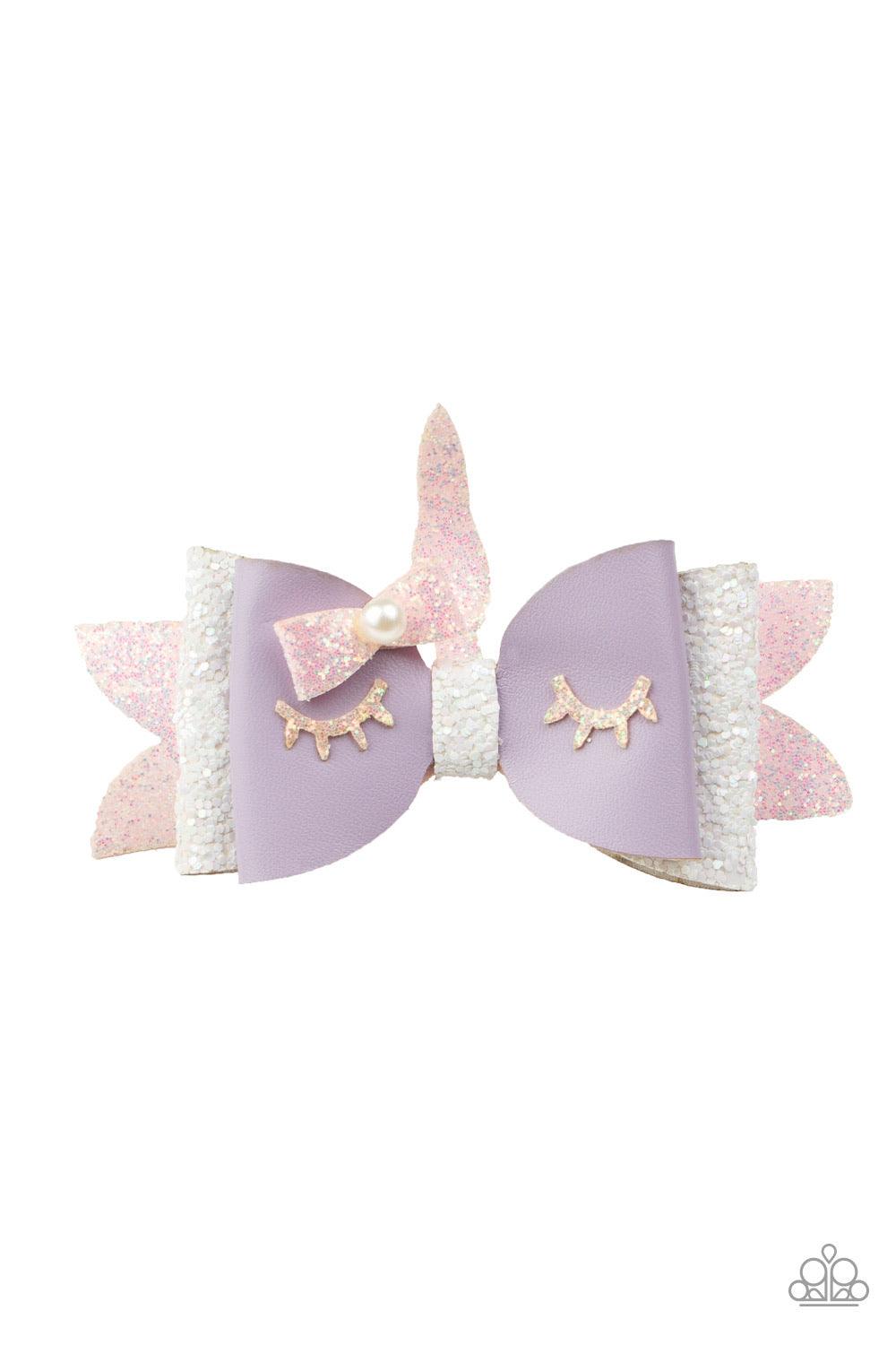Paparazzi Accessories All Rainbows And Unicorns - Purple A sparkling pink horn crowns a glittery pink, white, and purple hair bow. Featuring glittery gold eyelashes and a pearl dotted bow, the colorful suede delicately knots into an adorable unicorn. Feat