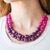 Paparazzi Accessories Island Excursion - Multi Tiers of round and abstract pink beading give way to purple beading, creating a cascading complementary ombre-effect below the collar. Features an adjustable clasp closure. Jewelry
