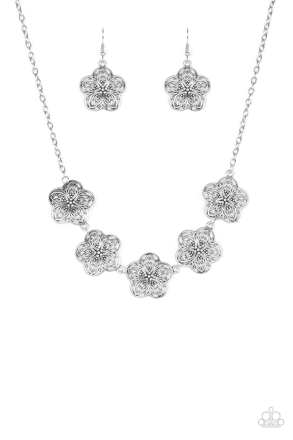 Paparazzi Accessories Garden Groove - Silver Ornate silver flowers connect below the collar for a simply seasonal look. Features an adjustable clasp closure. Sold as one individual necklace. Includes one pair of matching earrings. Jewelry
