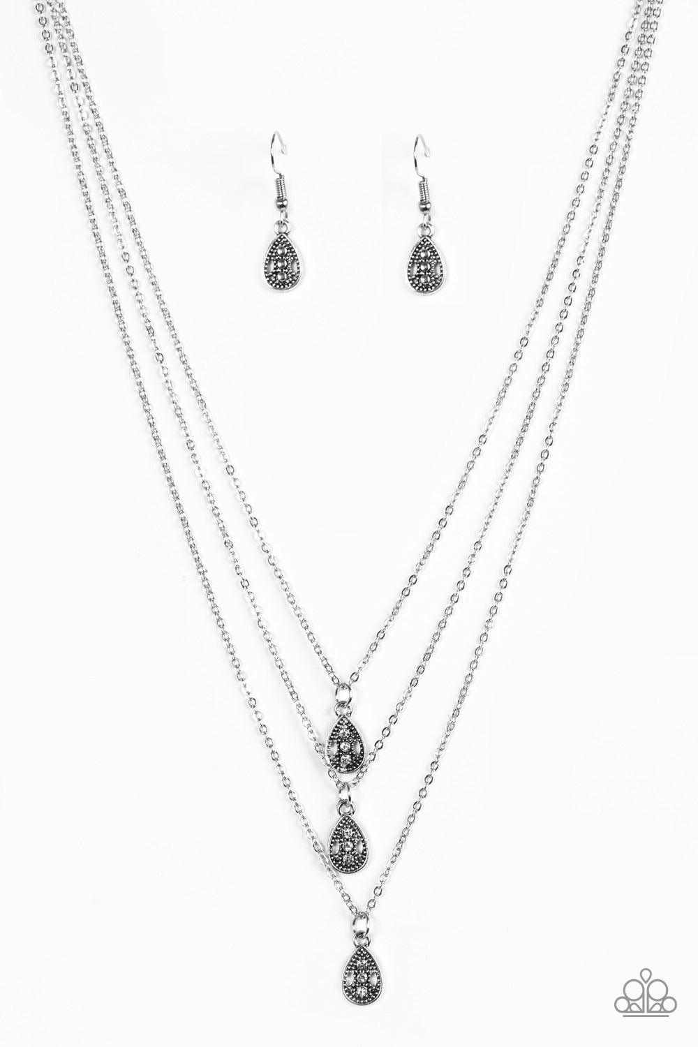 Paparazzi Accessories Radiant Rainfall - White Encrusted in glittery white rhinestones, three shimmery silver teardrops layer below the collar for a whimsical look. Features an adjustable clasp closure. Sold as one individual necklace. Includes one pair o