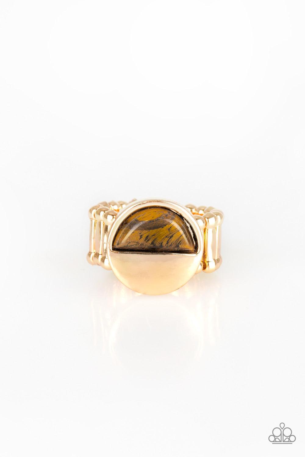 Paparazzi Accessories Stone Seeker - Brown Chiseled into a tranquil crescent shape, a radiant Tiger's Eye stone is pressed into the bottom half of a circular gold frame for an on-trend look. Features a stretchy band for a flexible fit. Jewelry