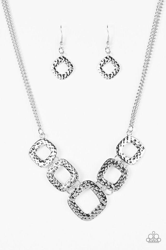 Paparazzi Accessories Wild Catch ~Silver Delicately hammered in shimmery textures, asymmetrical square silver frames link below the collar in a bold artisanal fashion. Features an adjustable clasp closure. Sold as one individual necklace. Includes one pai