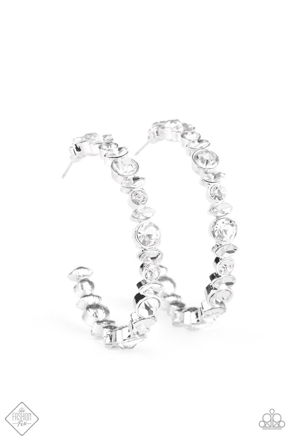 Paparazzi Accessories Can I Have Your Attention? - White A timeless collection of round and marquise-cut white rhinestones coalesce into a blinding silver hoop for a sassy, statement-making finish. Earring attaches to a standard post fitting. Hoop measure